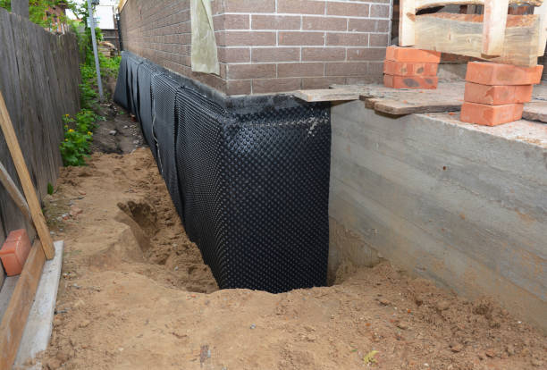 SJ Waterproofing Pros technician performing targeted Waterproofing assessment in Hauppauge, NY